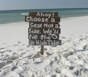 Image of ceremony sign that reads: Ahoy! Choose a Seat Not a Side, We'll tie the Knot at High Tide - Marry Me In Destin