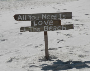 Image of wedding sign that read: All You Need is LOVE - Marry Me In Destin